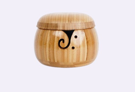 Bamboo yarn bowl with lid on a clean cream background - Caldova