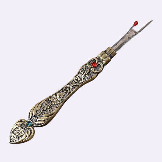 Seam ripper on clean background - Caldova